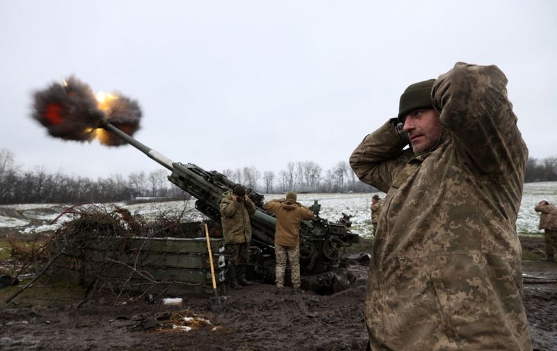 Ukrainian artillerymen fire a M777 howitzer towards Russian positions on the frontline of eastern Ukraine, on November 23, 2022, amid the Russian invasion of Ukraine. (Photo by Anatolii Stepanov / AFP)