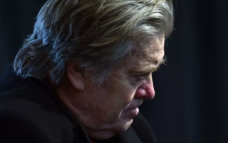 (FILES): This March 15, 2017 file photo shows then Assistant and White House chief strategist to US President Donald Trump, Steve Bannon listening as Trump delivers remarks with auto industry executives at American Center for Mobility in Ypsilanti, Michigan.
Rattled by a one-two punch of betrayal and scandal, Donald Trump on Thursday, January 4, 2017 tried to block the publication of a bare-knuckle book that portrays his White House as a fetid stew of backbiting, incompetence and dysfunction. Trump instructed his lawyers to prevent the release of "Fire and Fury: Inside the Trump White House" -- an expose by author and political muckraker Michael Wolff -- which quotes key Trump aides expressing serious doubt about his fitness for office.  The book -- which paints Trump as mentally unstable and far out of his depth -- quotes at length his former ally and chief strategist Steve Bannon, who also received a "cease and desist" order from Trump's attorneys.
 / AFP PHOTO / Nicholas Kamm