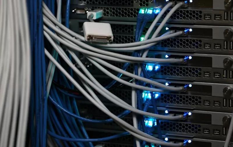 NEW YORK, NY - NOVEMBER 10: Network cables are plugged in a server room on November 10, 2014 in New York City. U.S. President Barack Obama called on the Federal Communications Commission to implement a strict policy of net neutrality and to oppose content providers in restricting bandwith to customers.   Michael Bocchieri/Getty Images/AFP