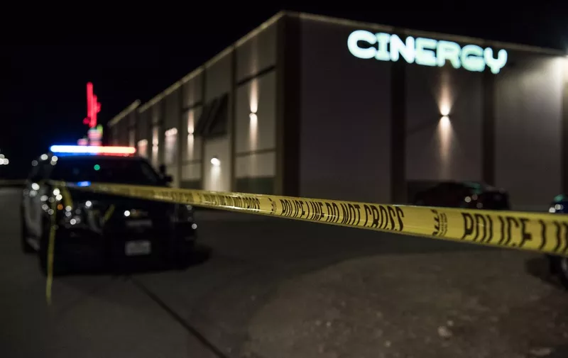 ODESSA, TEXAS - AUGUST 31: Police cars and tape block off a crime scene outside the Cinergy Odessa movie theater where a gunman was shot and killed on August 31, 2019 in Odessa, Texas. Officials say the unidentified suspect killed 5 people and injured 21 in Odessa and nearby Midland.   Cengiz Yar/Getty Images/AFP