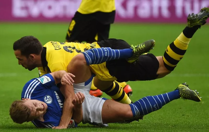 Schalke's midfielder Max Meyer (L) and Dortmund's midfielder Gonzalo Castro (R) vie for the ball during the German first division football Bundesliga match Borussia Dortmund vs FC Schalke 04 on November 8, 2015, 2015 in Dortmund, western Germany. 


RESTRICTIONS: DURING MATCH TIME: DFL RULES TO LIMIT THE ONLINE USAGE TO 15 PICTURES PER MATCH AND FORBID IMAGE SEQUENCES TO SIMULATE VIDEO. 
==RESTRICTED TO EDITORIAL USE ==
FOR FURTHER QUERIES PLEASE CONTACT THE DFL DIRECTLY AT + 49 69 650050.