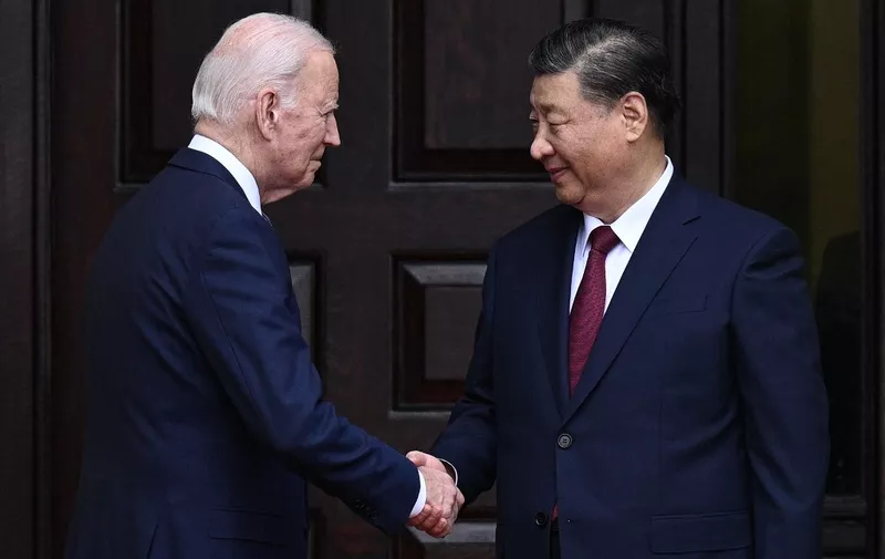 US President Joe Biden greets Chinese President Xi Jinping before a meeting during the Asia-Pacific Economic Cooperation (APEC) Leaders' week in Woodside, California on November 15, 2023. Biden and Xi will try to prevent the superpowers' rivalry spilling into conflict when they meet for the first time in a year at a high-stakes summit in San Francisco on Wednesday. With tensions soaring over issues including Taiwan, sanctions and trade, the leaders of the world's largest economies are expected to hold at least three hours of talks at the Filoli country estate on the city's outskirts. (Photo by Brendan SMIALOWSKI / AFP)