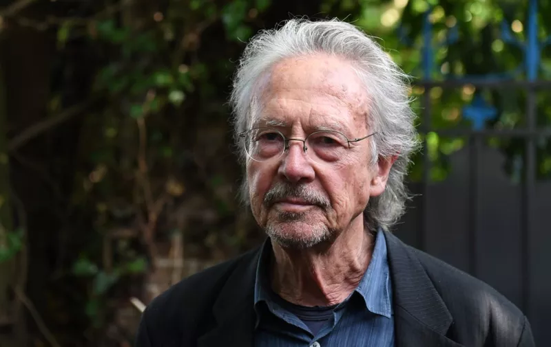 Austrian writer Peter Handke poses in Chaville, in the Paris surburbs, on October 10, 2019 after he was awarded with the 2019 Nobel Literature Prize. - Austrian Peter Handke, one of the most original German-language writers alive, who once used his famously sharp tongue to call for the Nobel Prize in Literature to be abolished, was awarded with the 2019 Nobel Literature Prize on October 10. The prize brings its winner "false canonisation" along with "one moment of attention (and) six pages in the newspaper," the novelist, playwright, poet and translator told Austrian media in 2014. (Photo by Alain JOCARD / AFP)