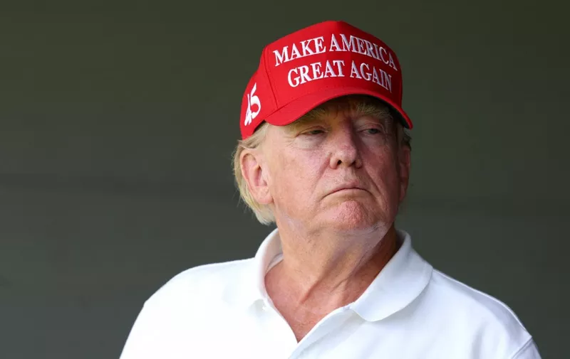 STERLING, VIRGINIA - MAY 26: Former US President Donald Trump watches from a box on the 18th green during day one of the LIV Golf Invitational - DC at Trump National Golf Club on May 26, 2023 in Sterling, Virginia.   Rob Carr/Getty Images/AFP (Photo by Rob Carr / GETTY IMAGES NORTH AMERICA / Getty Images via AFP)