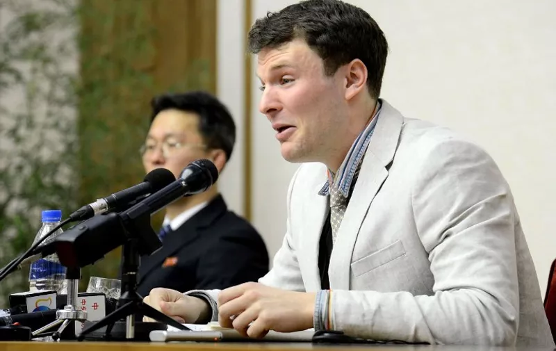 This photo taken on February 29, 2016 and released by North Korea's official Korean Central News Agency (KCNA) on March 1, 2016 shows US student Otto Frederick Warmbier (R), who is arrested for committing hostile acts against North Korea, speaking at a press conference in Pyongyang. A US student arrested in North Korea has admitted to stealing propaganda material at the behest of a US Methodist church and with the encouragement of a secret university society, state media reported on February 29.   REPUBLIC OF KOREA OUT AFP PHOTO / KCNA via KNS
THIS PICTURE WAS MADE AVAILABLE BY A THIRD PARTY. AFP CAN NOT INDEPENDENTLY VERIFY THE AUTHENTICITY, LOCATION, DATE AND CONTENT OF THIS IMAGE. THIS PHOTO IS DISTRIBUTED EXACTLY AS RECEIVED BY AFP. ---EDITORS NOTE--- RESTRICTED TO EDITORIAL USE - MANDATORY CREDIT "AFP PHOTO/KCNA VIA KNS" - NO MARKETING NO ADVERTISING CAMPAIGNS - DISTRIBUTED AS A SERVICE TO CLIENTS / AFP PHOTO / KCNA / KCNA VIA KNS