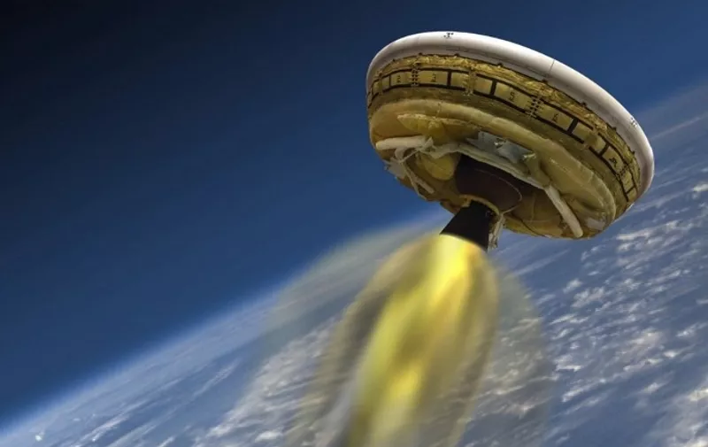 (FILES)This June 2, 2015 NASA artist's concept shows the test vehicle for NASA's Low-Density Supersonic Decelerator(LDSD), designed to test landing technologies for future Mars missions. The test launch of a NASA flying saucer equipped with a supersonic parachute that may one day help spacecraft land on Mars was postponed again on June 5, 2015 due to bad weather.The reason for the scrub was "unstable wind conditions near the surface that would prevent the launch," NASA said, adding it would assess chances for the next possible launch, on June 6, 2015. AFP PHOTO/NASA/JPL-CALTECH  =  RESTRICTED TO EDITORIAL USE / MANDATORY CREDIT: "AFP PHOTO HANDOUT-NASA/JPL-CALTECH/ NO MARKETING - NO ADVERTISING CAMPAIGNS / DISTRIBUTED AS A SERVICE TO CLIENTS
