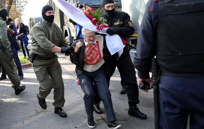 Law enforcement officers arrest and detain opposition activist Nina Baginskaya,73, during a rally to protest against the presidential election results in Minsk on September 19, 2020. - Belarus President Alexander Lukashenko, who has ruled the ex-Soviet state for 26 years, claimed to have defeated opposition leader Svetlana Tikhanovskaya with 80 percent of the vote in the August 9, elections. (Photo by - / TUT.BY / AFP)