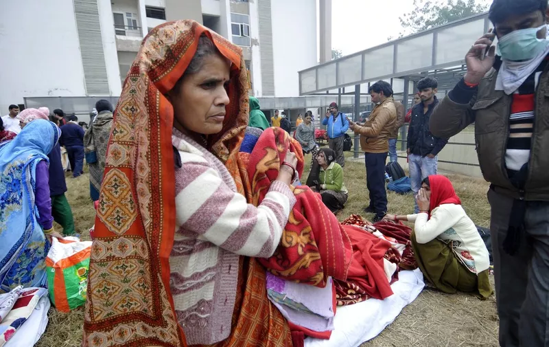 Hospital patients, medical staff and visitors at the compund grounds after being evacuated from a fire incident in the basement of ESIC Hospital at Sector 24
Fire at ESIC Hospital, Noida, India - 09 Jan 2020,Image: 491897053, License: Rights-managed, Restrictions: , Model Release: no
