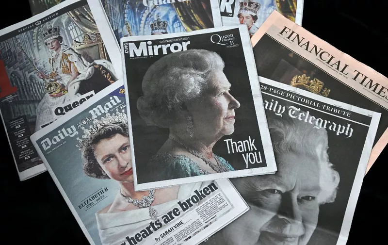 A photograph taken on September 9, 2022, shows the front pages of British news papers a day after Queen Elizabeth II died at the age of 96. - Queen Elizabeth II, the longest-serving monarch in British history and an icon instantly recognisable to billions of people around the world, died at her Scottish Highland retreat on September 8. (Photo by Glyn KIRK / AFP)