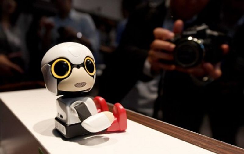 This picture taken on September 27, 2016 shows Toyota Motors' new communication robot 'Kirobo Mini' on dosplay during a press preview in Tokyo.
Equipped with artificial intelligence and a built-in camera, the robot is capable of recognising the face of the person speaking to him and responding in unscripted conversation or even starting a chat. / AFP PHOTO / TOSHIFUMI KITAMURA