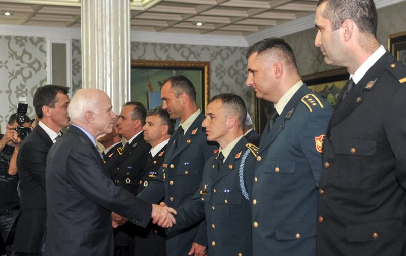 U.S. Senator John McCain (L) shakes hand with Montenegrin army officers during his visits in Podgorica on April 12, 2017.
US President Donald Trump signed off on Montenegro's accession to NATO on April 11, 2017, removing a potential hurdle to the Balkan nation becoming the alliance's 29th member. / AFP PHOTO / Savo PRELEVIC