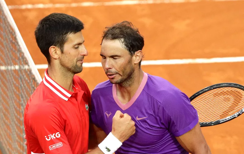 Spain's Rafael Nadal, right, greets Serbia's Novak Djokovic after deleting him at their final match of the Italian Open tennis tournament, in Rome, Sunday, May 16, 2021. Nadal won 7-5, 1-6, 6-3. (AP Photo/Gregorio Borgia)