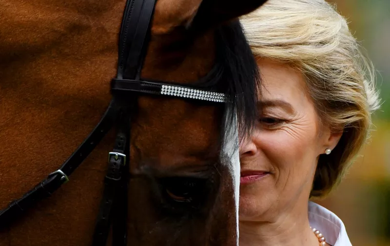 German Defence Minister Ursula von der Leyen attends the prize giving ceremony of the jumping competition of the Grand Prix of Aachen during the World Equestrian Festival CHIO in Aachen Germany on July 23,2017. (Photo by PATRIK STOLLARZ / AFP)