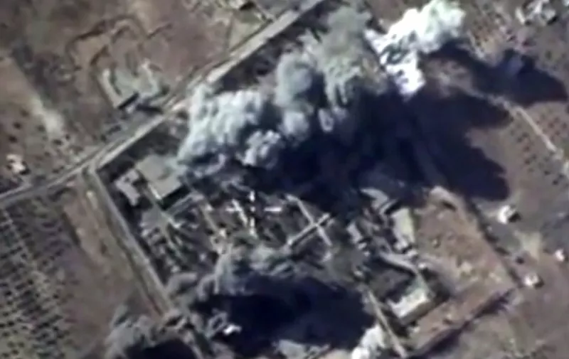 A video grab made on October 12, 2015, shows an image taken from a footage made available on the Russian Defence Ministry's official website, purporting to show explosions after airstrikes carried out by Russian air force on what Russia says was an Islamic State training camp in the Syrian province of Idlib. Russia's air force hit 53 targets in Syria in the past 24 hours, the defence ministry said on October 12, as Moscow continues a bombing campaign it says is aimed against the Islamic State jihadist group. AFP PHOTO / RUSSIAN DEFENCE MINISTRY
 RESTRICTED TO EDITORIAL USE - MANDATORY CREDIT " AFP PHOTO / RUSSIAN DEFENCE MINISTRY" - NO MARKETING NO ADVERTISING CAMPAIGNS - DISTRIBUTED AS A SERVICE TO CLIENTS  / AFP / RUSSIAN DEFENCE MINISTRY / HO