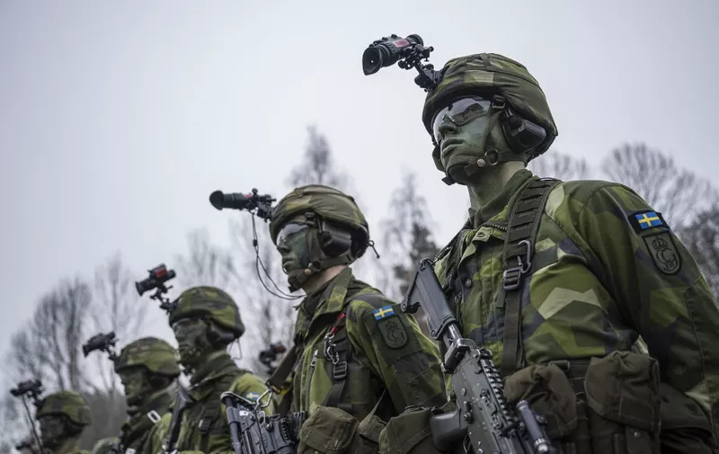 Soldiers from the 13th counter intelligence battalion, 2nd reconnaissance platoon of the Swedish Armed Forces, participate in military exercise in Kungsangen, near Stockholm on February 27, 2024. (Photo by Jonathan NACKSTRAND / AFP)