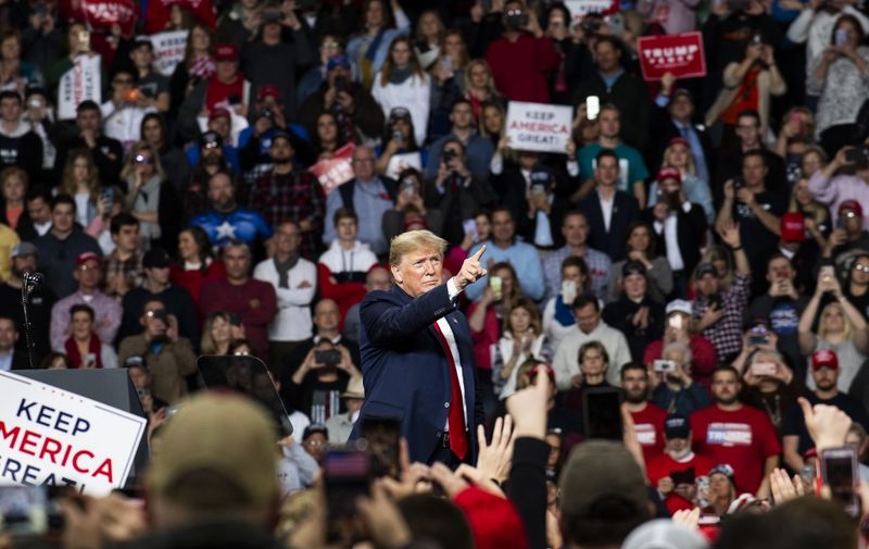 TOLEDO, OH - JANUARY 09: President Donald Trump points toward the crowd at the conclusion of a "Keep America Great" campaign rally at the Huntington Center on January 9, 2020 in Toledo, Ohio. President Trump won the swing state of Ohio in 2016 by eight points over his opponent Hillary Clinton.   Brittany Greeson/Getty Images/AFP