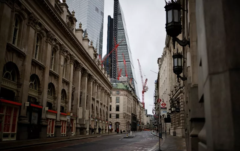 An empty Cornhill street is pictured, with the Leadenhall Building, commonly called the "Cheesegrater, in the background, in the City of London, as Britain enters a national lockdown in London on January 5, 2021. - England's six-week lockdown, which began at midnight, emulates the first national coronavirus curbs in place from March to June -- but goes further than another instituted in November when schools remained open. Authorities in Wales, Scotland and Northern Ireland have all taken similar measures, putting the UK as a whole in lockdown. (Photo by Tolga Akmen / AFP)