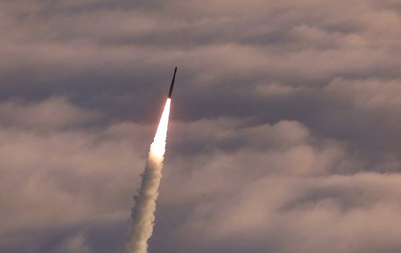 A modified Minuteman II missile -or "target vehicle"- leaves a vapor trail across the sky shortly after lift off from Vandenberg Air Force Base, CA, to be intercepted by a "kill vehicle" missile launched off of the Marshall Islands in the South Pacific 14 July 2001 . The interceptor test was part of the National Missile Defense program. AFP PHOTO/DEPARTMENT OF DEFENSE (Photo by DEPARTMENT OF DEFENSE / AFP)