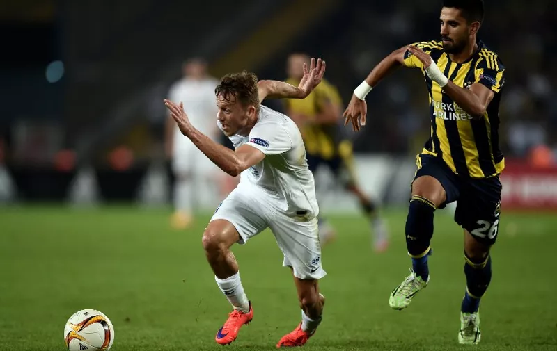 Molde's Mattias Mostrom (L) vies for the ball with Fenerbahce Alper Potuk (R) during the Europa League football match between Fenerbahce and Molde on September 17, 2015 at the Ulker Fenerbahce Sukru saracoglu stadium in istanbul. AFP PHOTO / OZAN KOSE