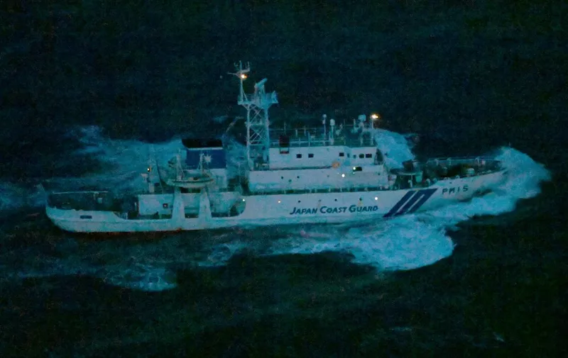 An aerial photo taken from Yomiuri's jet plane shows a vessel of the Japan Coast Guard searching for a tour boat, which is missing in waters off Shiretoko Penisula, a World Heritage site,  eastern Hokkaido on April 23rd, 2022. The missing tour boat, identified as  KAZU I, carrying 24 passengers including two children, and two crew members, has been unknown after a distress message.  ( The Yomiuri Shimbun ) (Photo by Kanji Tada / Yomiuri / The Yomiuri Shimbun via AFP)