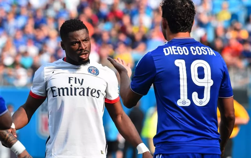 Paris Saint-Germain's Serge Aurier (L) exchanges words with Chelsea's Diego Costa after a foul during an International Champions Cup football match against in Charlotte, North Carolina, on July 25, 2015.    AFP PHOTO/NICHOLAS KAMM