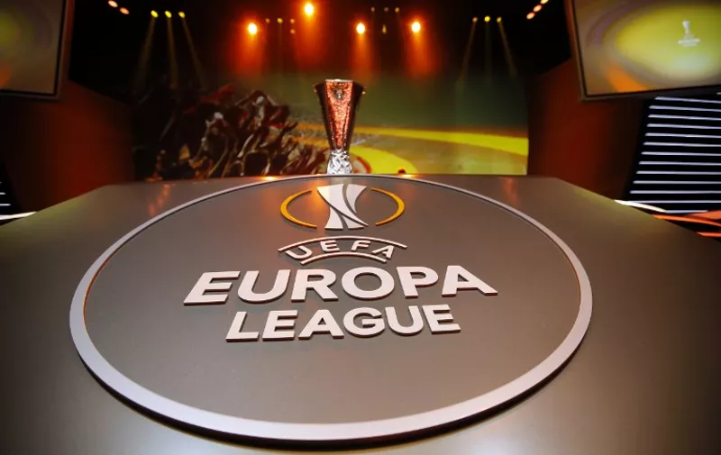 The UEFA Cup trophy and the logo are pictured during the draw for the UEFA Europa League football group stage 2015/16, on August 28, 2015 in Monaco.  / AFP / VALERY HACHE