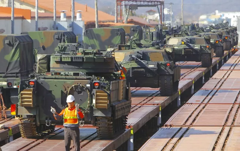 US M1A1 tanks of 11th Armor Cavalry Regiment from the National Training Center at Fort Irwin, California, US, are loaded onto trains during a US Army Preposition Stocks-4 drill at Camp Carroll in Waegwan, about 290 km (180 miles) southeast of Seoul on March 3, 2011. AFP PHOTO / WON DAE-YEON
