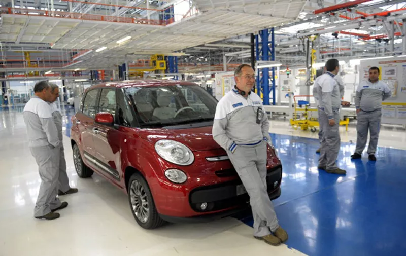 Employees stand next to  a new Fiat 500 during the inauguration of a new factory in Kragujevac on April 16, 2012. General manager of Fiat and Chrysler Sergio Marchionne opened today an auto plant in the central Serbian town of Kragujevac to produce a new Fiat 500L model. AFP PHOTO/ ALEXA STANKOVIC (Photo credit should read ALEXA STANKOVIC/AFP/Getty Images)