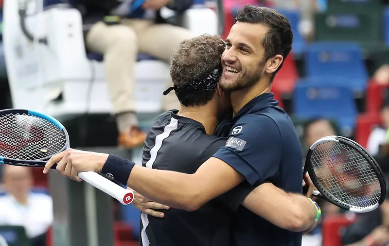 SHANGHAI, CHINA - OCTOBER 13:  Mate Pavic (R) of Croatia and Bruno Soares of Brazil celebrate after winning the Men's doubles final match against Lukasz Kubot of Poland and Marcelo Melo of Brazil on day nine of 2019 Shanghai Rolex Masters at Qi Zhong Tennis Centre on October 13, 2019 in Shanghai, China.  (Photo by Lintao Zhang/Getty Images)