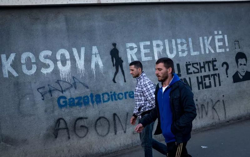 PRISTINA, KOSOVO - MAY 03: People walk past graffiti on May 3, 2019 in Pristina, Kosovo. A recent EU-backed summit failed to restart negotiations between leaders from Kosovo and Serbia over a final resolution of Kosovo’s sovereignty. In previous talks, the countries’ presidents have signaled an openness to land swaps, which could see the majority-Serb areas north of the Ibar River annexed into Serbia. In the northern city of Mitrovica, the Ibar River divides the city, with Serbs dominating the north and ethnic Albanians to the south. In exchange for ceding areas above the Ibar, Kosovo would take the predominantly ethnic Albanian area of the Presevo Valley in southern Serbia. Many political leaders in Kosovo and across Europe are vehemently opposed to ethnic partition and land swaps, fearing that a change in borders could reignite a conflict that resulted in thousands of deaths from 1998 to 1999. During the conflict, Serbian forces started an ethnic cleansing campaign which pushed approximately one million predominantly muslim Kosovar Albanians from their homes. After diplomatic solutions failed, NATO intervened with a 78-day, United-States led bombing campaign to force Serbian troops to withdraw. After nine years under United Nations control, Kosovo declared independence from Serbia in 2008. Since the declaration, Kosovo has been recognized by 111 of the United Nation’s 193 member states. Serbia, Russia, China and five EU countries still do not recognize it, keeping the country into a state of limbo. (Photo by Chris McGrath/Getty Images)