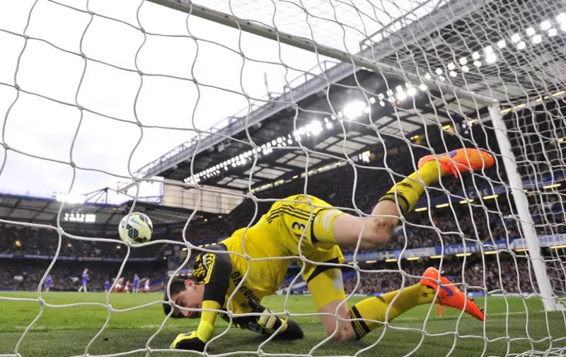 Chelsea&#8217;s Belgian goalkeeper Thibaut Courtois falls into his own goal after chasing back but failing to keep out a long range shot from Stoke City&#8217;s Scottish midfielder Charlie Adam (unseen) who scored to equalise 1-1 during the English Premier League football match between Chelsea and Stoke City at Stamford Bridge in London on April 4, [&hellip;]