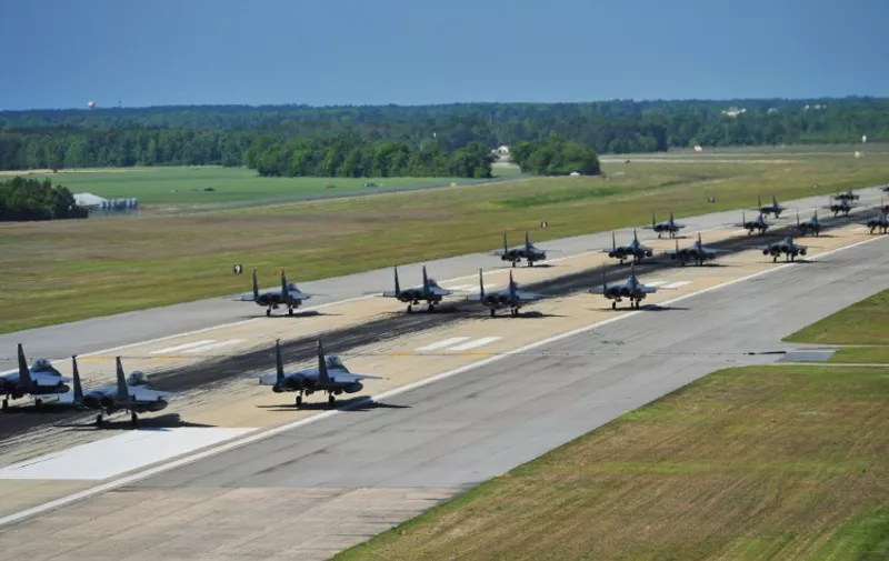 A picture downloaded from the US air force website shows F-15E Strike Eagles of the 4th Fighter Wing performing an "Elephant Walk" as they taxi down the runway during a Turkey Shoot training mission on Seymour Johnson Air Force Base on April 16, 2012. The United States and its allies built their case on August 28, 2013 for likely military action against the regime in war-torn Syria over alleged chemical weapons attacks, despite stern warnings from Russia AFP PHOTO/US AIR FORCE/Elizabeth Rissmiller  == RESTRICTED TO EDITORIAL USE - MANDATORY CREDIT "AFP PHOTO /US AIR FORCE/Elizabeth Rissmiller " - NO MARKETING NO ADVERTISING CAMPAIGNS - DISTRIBUTED AS A SERVICE TO CLIENTS ==
 / AFP PHOTO / US AIR FORCE FILES / Elizabeth Rissmiller
