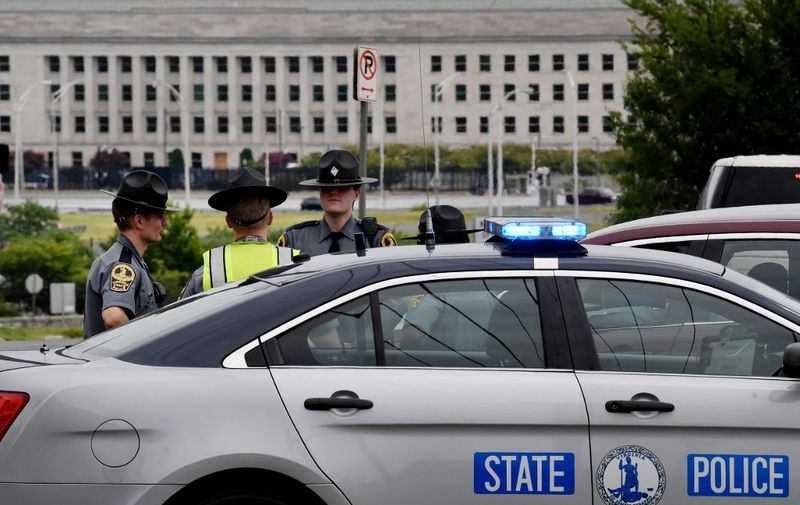 Virginia Sate Troopers patrol near the Pentagon after report of an active shooter and lockdown in Washington, DC, on August 3, 2021. - The Pentagon was on lockdown after a shooting at a subway station just outside the secure US military headquarters. Employees in the US Defense Department headquarters in the Arlington suburb of Washington were ordered to shelter in place amid reports of several gunshots and injuries in the station, the entrance of which is just a few dozen yards (meters) from the building's main doors. (Photo by Olivier DOULIERY / AFP)