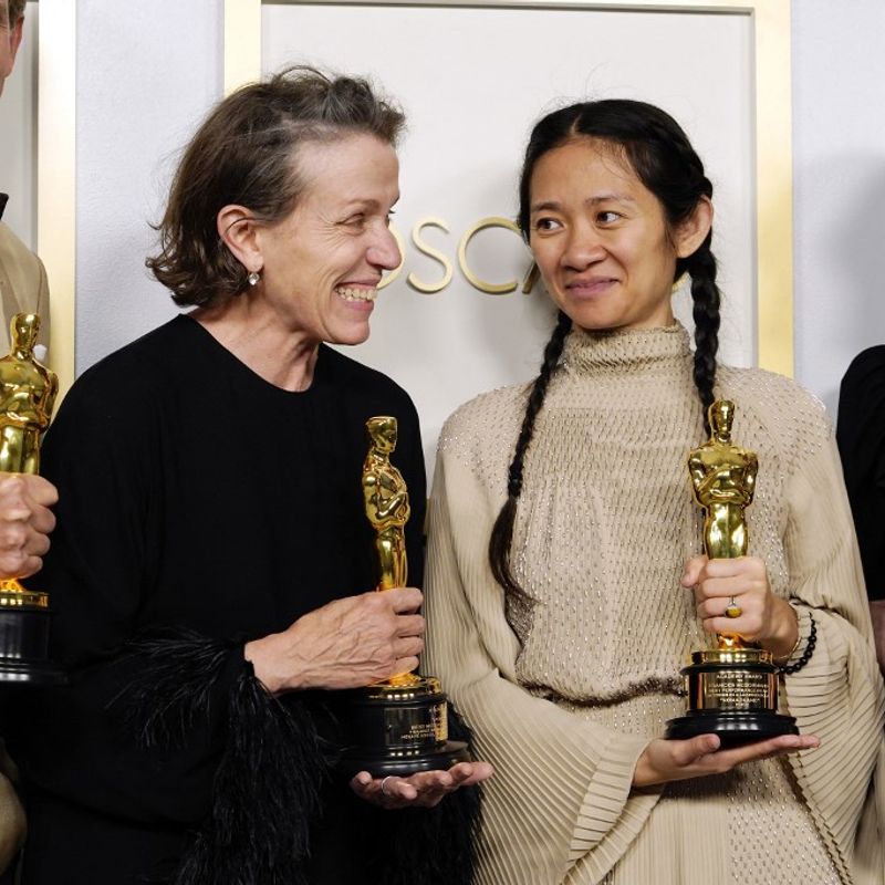 LOS ANGELES, CALIFORNIA - APRIL 25: (L-R) Peter Spears, Frances McDormand, Chloe Zhao and Mollye Asher, winners of Best Picture for "Nomadland," pose in the press room at the Oscars on Sunday, April 25, 2021, at Union Station in Los Angeles.   Chris Pizzello-Pool/Getty Images/AFP (Photo by POOL / GETTY IMAGES NORTH AMERICA / Getty Images via AFP)