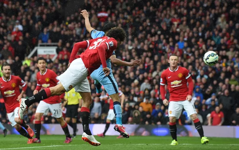 Manchester United&#8217;s Belgian midfielder Marouane Fellaini (C) scores their second goal during the English Premier League football match between Manchester United and Manchester City at Old Trafford in Manchester, north west England, on April 12, 2015. AFP PHOTO / RESTRICTED TO EDITORIAL USE. NO USE WITH UNAUTHORIZED AUDIO, VIDEO, DATA, FIXTURE LISTS, CLUB/LEAGUE LOGOS OR [&hellip;]