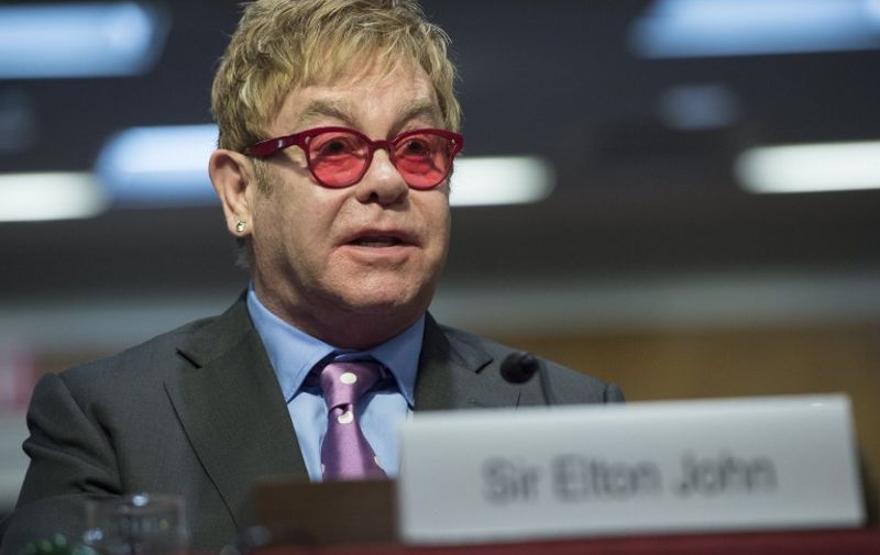 Singer Elton John, founder of the Elton John AIDS Foundation, testifies about global health programs during a Senate Appropriations Subcommittee hearing on Capitol Hill in Washington, DC, May 6, 2015. AFP PHOTO / SAUL LOEB