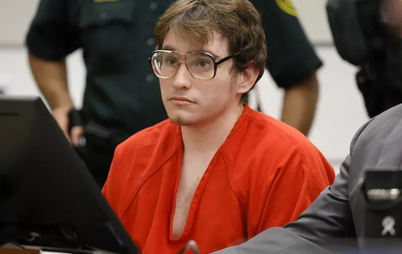 Marjory Stoneman Douglas High School shooter Nikolas Cruz sits at the defense table during a victim impact statement at his sentencing hearing at the Broward County Courthouse in Fort Lauderdale on November 2, 2022. - Cruz, who pleaded guilty to 17 counts of premeditated murder in the 2018 shootings, is the most lethal mass shooter to stand trial in the US. The hearing concluded today, November 2, 2022 when Circuit Judge Elizabeth Scherer sentenced Parkland school shooter Nikolas Cruz to life in prison without parole. (Photo by Amy Beth Bennett / POOL / AFP)