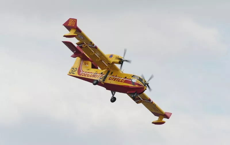 A Canadair  CL-415 performs a flying display during the public days of the 51st International Paris Air Show in Le Bourget, north of Paris, on June 20, 2015. AFP PHOTO  / ERIC PIERMONT