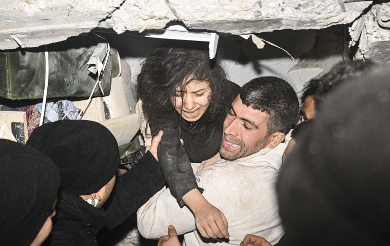 KAHRAMANMARAS, TURKIYE - FEBRUARY 06: 17-year-old Hulya Irem Ister rescued by the personnel from under rubble of a collapsed building after 7.7 and 7.6 magnitude earthquakes hit Turkiye's Kahramanmaras, on February 06, 2023. Disaster and Emergency Management Authority (AFAD) of Turkiye said the 7.7 magnitude quake struck at 4.17 a.m. (0117GMT) and was centered in the Pazarcik district and 7.6 magnitude quake struck in Elbistan district in the province of Kahramanmaras in the south of Turkiye. Gaziantep, Sanliurfa, Diyarbakir, Adana, Adiyaman, Malatya, Osmaniye, Hatay, and Kilis provinces are heavily affected by the earthquakes. Emin Sansar / Anadolu Agency/ABACAPRESS.COM,Image: 754474937, License: Rights-managed, Restrictions: , Model Release: no