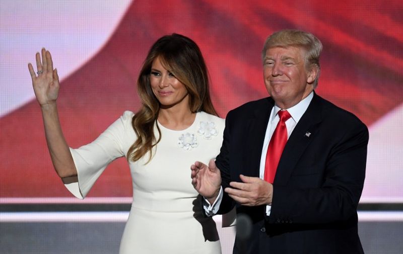 US Republican presidential candidate Donald Trump stands with his wife Melania on the final night of the Republican National Convention at the Quicken Loans Arena in Cleveland, Ohio on July 21, 2016.  / AFP PHOTO / Jim WATSON