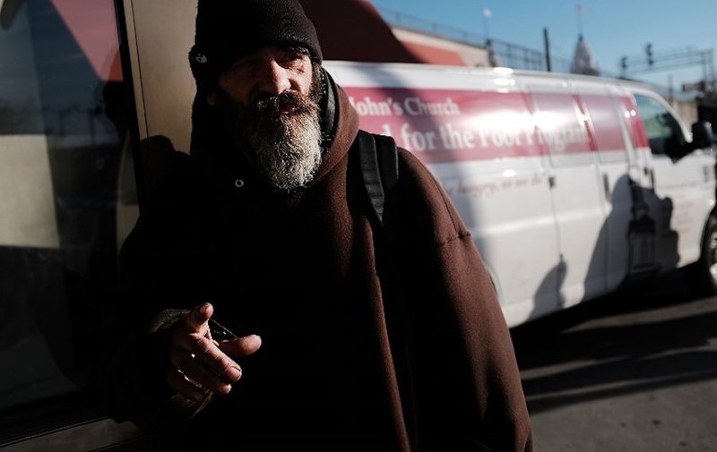 WORCESTER, MA - MARCH 20: Roger waits outside of a soup kitchen in an economically stressed section of the city on March 20, 2018 in Worcester, Massachusetts. Worcester, once a thriving manufacturing hub, has recently made moves into the medical industry, education and as a metropolitan hub for refugees in an attempt to revive its moribund economy. Like a growing number of Northeastern cities, Worcester has a chronic problem with homelessness and opioid addiction. The latest data in 2016 showed that 24.4% of Worcester residents were living below the poverty level. With overdoses increasing, the city plans to file litigation against pharmaceutical manufacturers and distributors of opioid products.   Spencer Platt/Getty Images/AFP