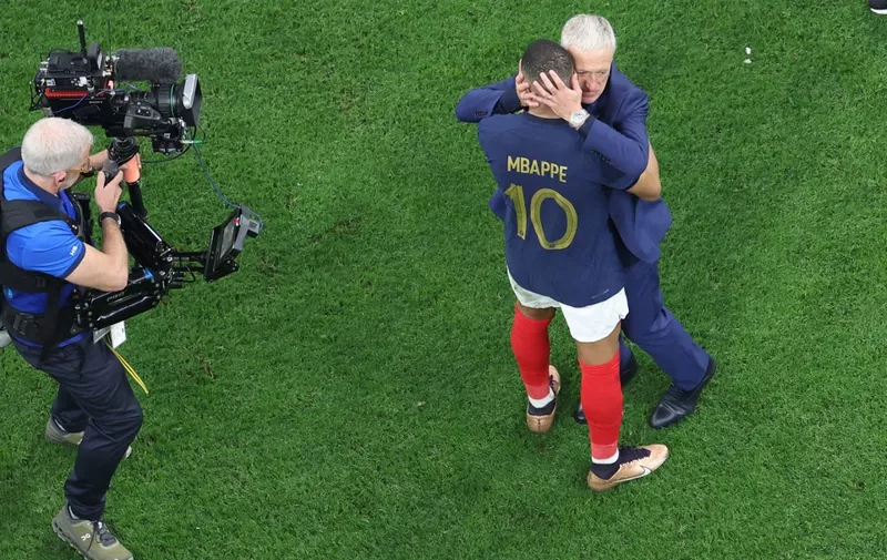 France's coach Didier Deschamps (R) and France's forward #10 Kylian Mbappe celebrate after they won the Qatar 2022 World Cup semi-final football match between France and Morocco at the Al-Bayt Stadium in Al Khor, north of Doha on December 14, 2022. (Photo by Giuseppe CACACE / AFP)