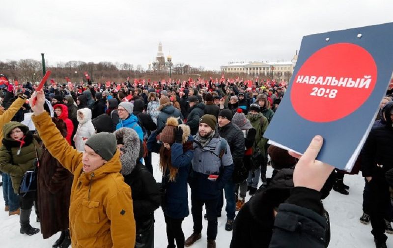 Supporters of Russian opposition leader Alexey Navalny hold ballots as a symbol to nominate him as opposition candidate for the upcoming presidential election in Moscow on December 24, 2017.
Alexei Navalny, seen as the only Russian opposition leader who stands a fighting chance of challenging strongman Vladimir Putin, seeks to get his name on the ballot for a March vote, with supporters gathering across Russia to endorse the move. / AFP PHOTO / Olga MALTSEVA