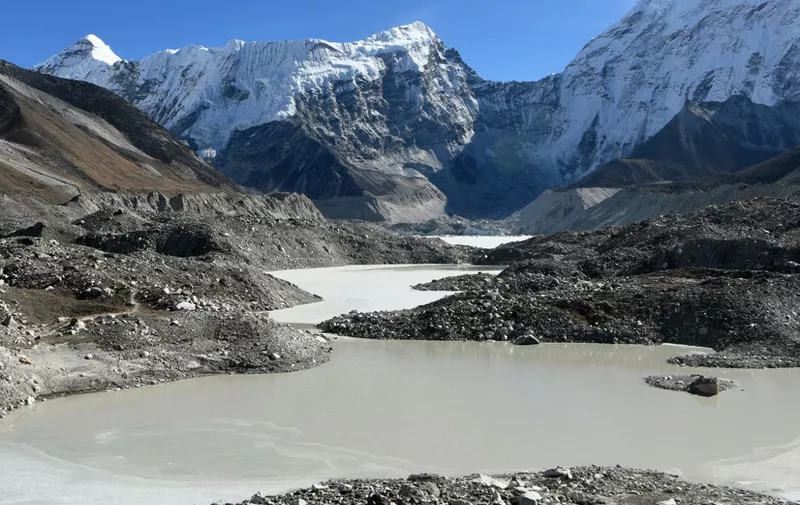 This picture taken on November 22, 2018 shows a general view of the Imja glacial lake controlled exit channel in the Everest region of the Solukhumbu district, some 140km northeast of Kathmandu. Formed in the shadow of Mount Everest, the turquoise depths of Nepal's Imja glacial lake would be a breathtaking miracle of nature to behold -- were they not a portent of catastrophic floods. (Photo by Prakash MATHEMA / AFP) / TO GO WITH Climate-energy-UN-COP24-Nepal, FOCUS by Paavan MATHEMA