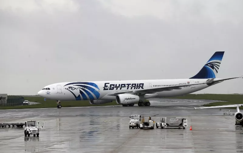(FILES) This file photo taken on May 19, 2016 shows an Egyptair Airbus A330 from Cairo taxiing at the Roissy-Charles De Gaulle airport near Paris after its landing a few hours after the MS804 Egyptair flight crashed into the Mediterranean. 
Pieces of the cabin from the missing EgyptAir plane which crashed into the Mediterranean last month have been found, Egyptian investigators said on June 15, 2016. The pieces of fuselage were found at "several sites", the Egyptian board of inquiry, said in a statement. The Airbus A320 which had been en route from Paris to Cairo disappeared on May 19, with the loss of all 66 people on board.
 / AFP PHOTO / THOMAS SAMSON
