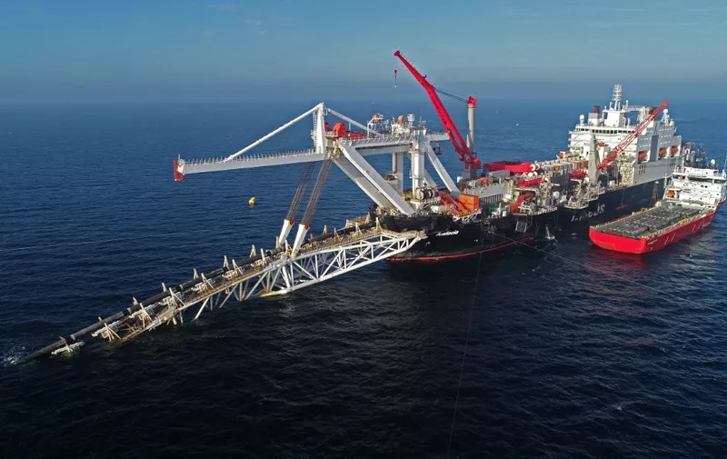 Aerial view taken on November 15, 2018 shows the ship "Audacia" of the Allseas offshore service company, from where parts of the Nord Stream 2 pipeline are laid in the Baltic Sea off the coast the island of Ruegen, northeastern Germany. - The German-Russian Chamber of Commerce on December 12, 2019 called for retaliatory sanctions after US lawmakers gave initial approval to a bill that would punish contractors working on the Russian pipeline to Germany. The 9.5-billion-euro ($10.6 billion) Nord Stream 2 pipeline will run under the Baltic Sea and is set to double shipments of Russian natural gas to Germany. (Photo by Bernd Wüstneck / dpa / AFP) / Germany OUT