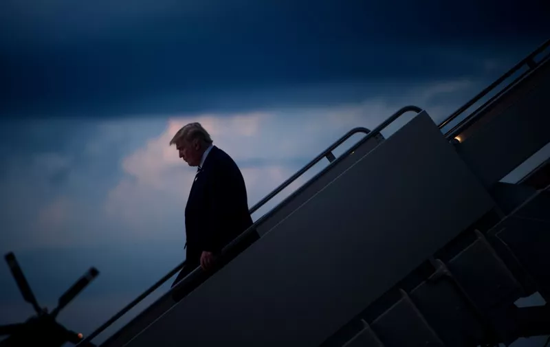 US President Donald Trump arrives at Andrews Air Force Base in Maryland on August 31, 2018. (Photo by Brendan Smialowski / AFP)