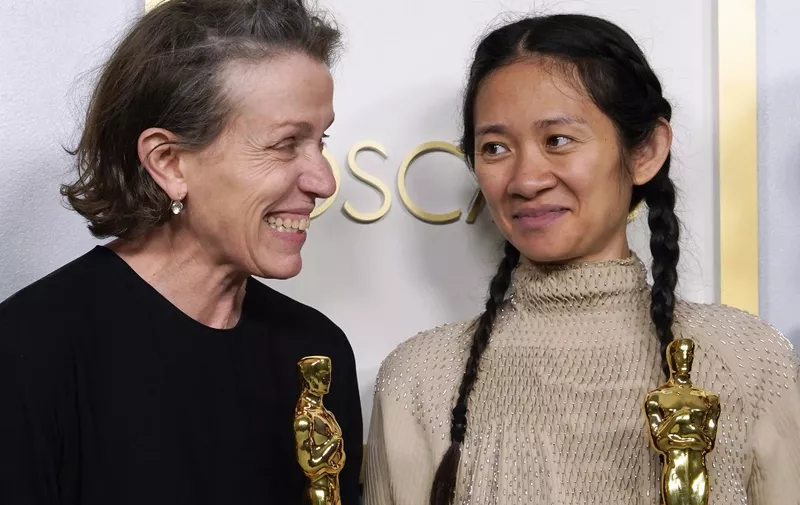 Producers Frances McDormand and Chloe Zhao, hold the Oscar for Best Picture for "Nomadland" as they pose in the press room at the Oscars on April 25, 2021, at Union Station in Los Angeles. - McDormand also won for Actress in a Leading Role for "Nomadland" and Chloe Zhao won Directing for "Nomadland" (Photo by Chris Pizzello / POOL / AFP)