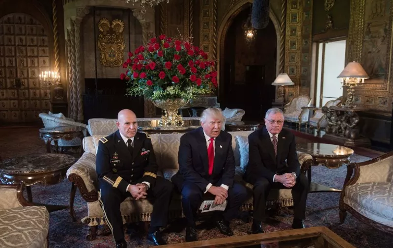 US President Donald Trump (C) announces US Army Lieutenant General H.R. McMaster (L) as his national security adviser and Keith Kellogg (R) as McMaster's chief of staff  at his Mar-a-Lago resort in Palm Beach, Florida, on February 20, 2017. / AFP PHOTO / NICHOLAS KAMM