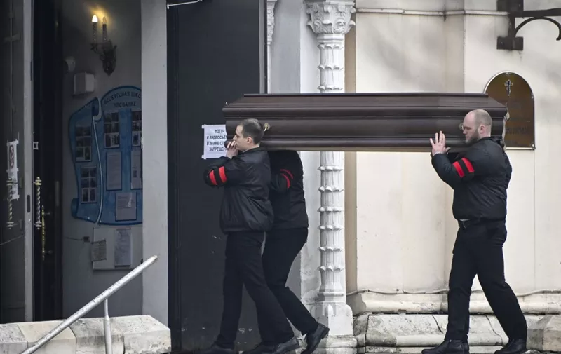Pallbearers carry the coffin of late Russian opposition leader Alexei Navalny into the Mother of God Quench My Sorrows church for his funeral service, in Moscow's district of Maryino on March 1, 2024. (Photo by Alexander NEMENOV / AFP)
